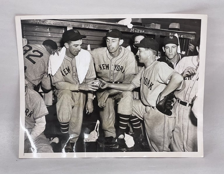 Item #1937NYG002 1937 Type 1 Photograph of Carl Hubbell Holding Ball After Winning Pennant-Clinching Game. Carl Hubbell, Cliff Melton, Dick Bartell, HOF.