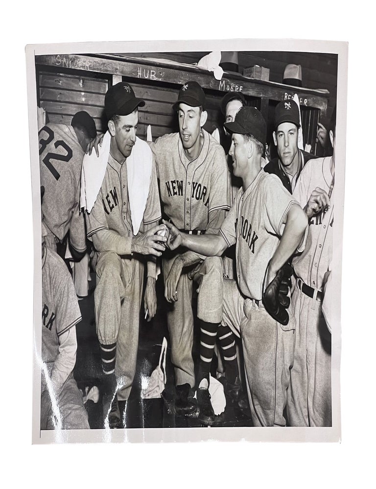 Item #1937NYG002 1937 Type 1 Photograph of Carl Hubbell Holding Ball After Winning Pennant-Clinching Game. Carl Hubbell, Cliff Melton, Dick Bartell, HOF.